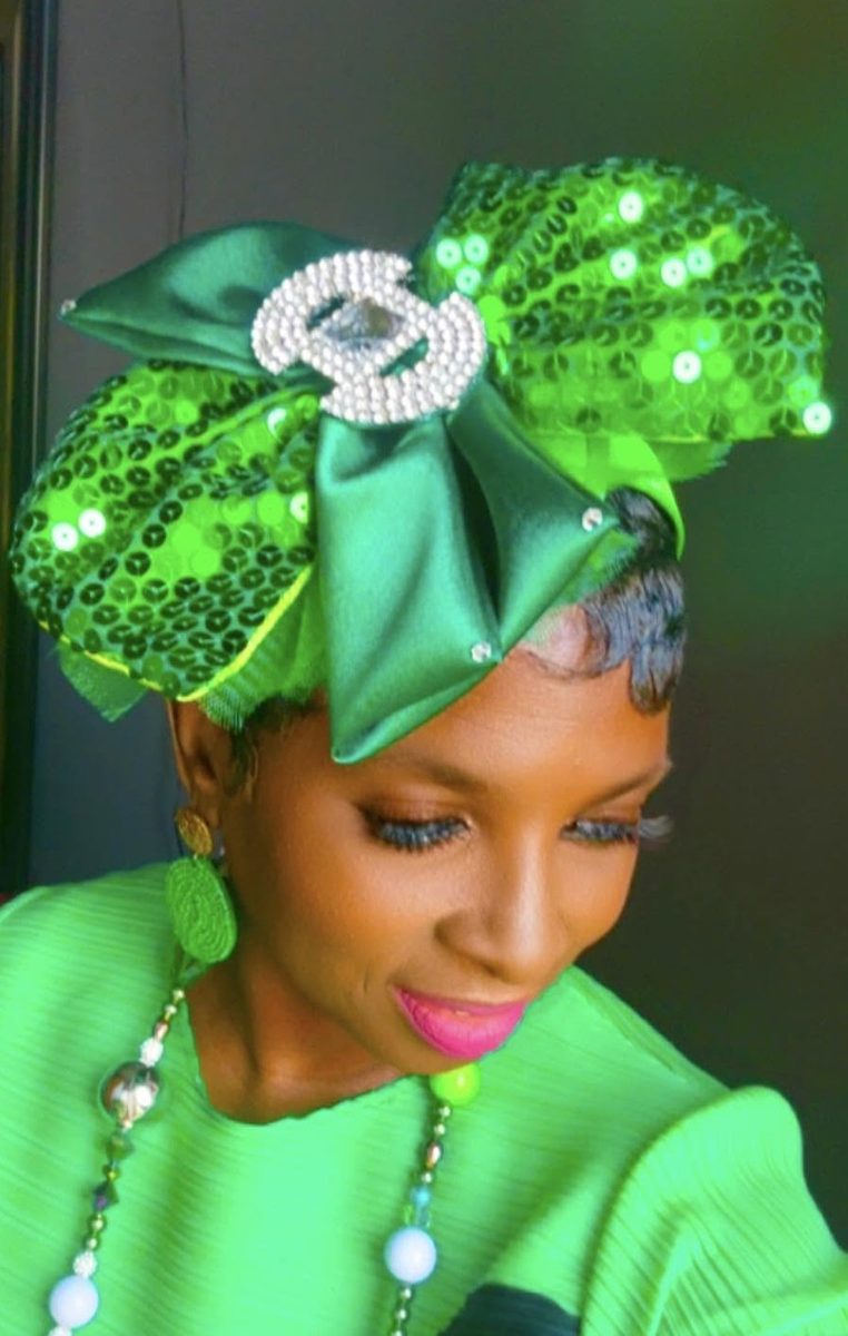 Green sequin bow headpiece with rhinestone brooch